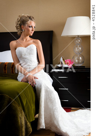 Beautiful bride in the bedroom with luxurious interior 4528841