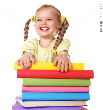 Child holding pile of books. 4529456
