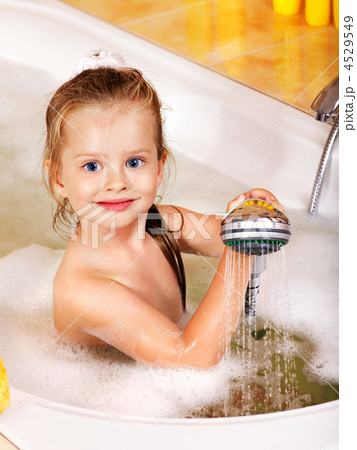 Child washing in bubble bath . 4529549