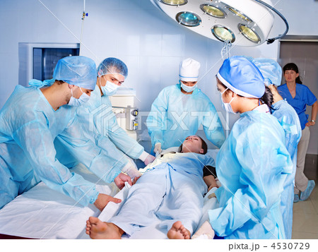 Woman on gurney in operating room. Woman on gurney in operating room. 4530729