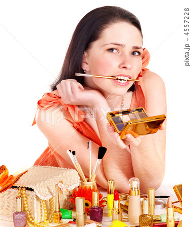 Girl applying makeup. 4557228