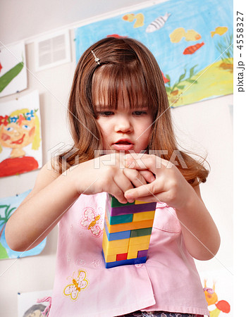 Child playing construction set. 4558327