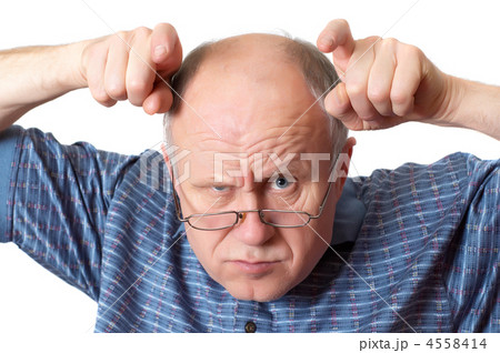 Bald senior man fooling around. Bald senior man fooling around. 4558414