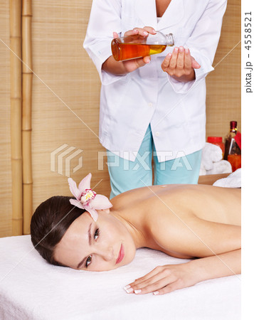 Young woman on massage table in beauty spa. Young woman on massage table in beauty spa. 4558521