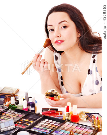 Girl applying makeup. Girl applying makeup. 4559265