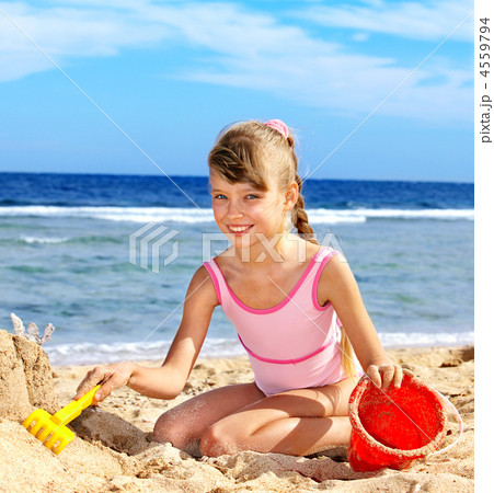 Child playing on  beach. 4559794