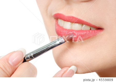 applying liquid glossy lipstick 4559809