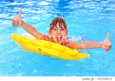 Child sitting on inflatable ring thumb up. Child sitting on inflatable ring thumb up. 4559951