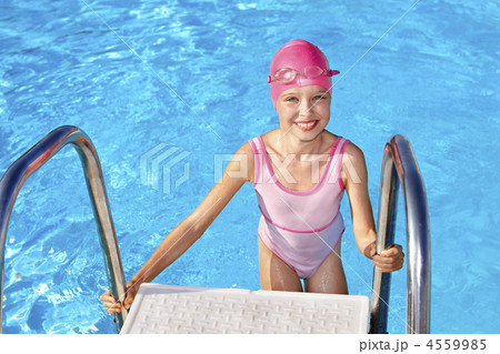 Child swimming in pool. 4559985