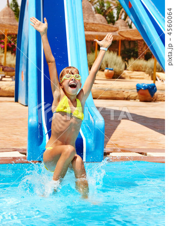 Child on water slide at aquapark. 4560064