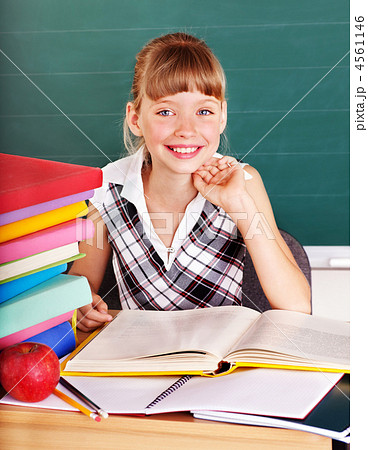 Schoolchild in classroom near blackboard. Schoolchild in classroom near blackboard. 4561146