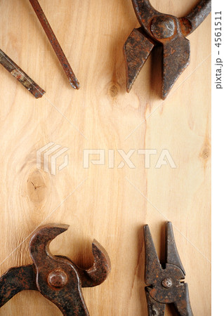 Old rusty tools on wooden background 4561511