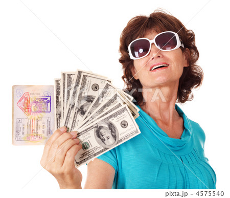 Senior woman holding passport and money. 4575540