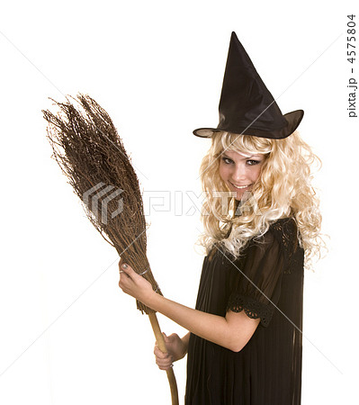 Halloween witch blond in black dress and hat with broom. 4575804