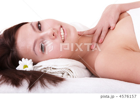 Young woman on massage table in beauty spa. 4576157