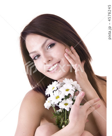 Beautiful young with flower. Massage. 4576245