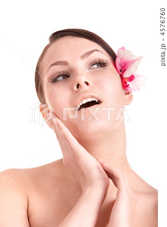 Beautiful girl with orchid flower. 4576760