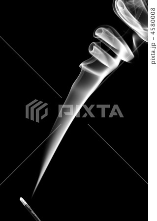 Stick with a white smoke. Isolated on black 4580008