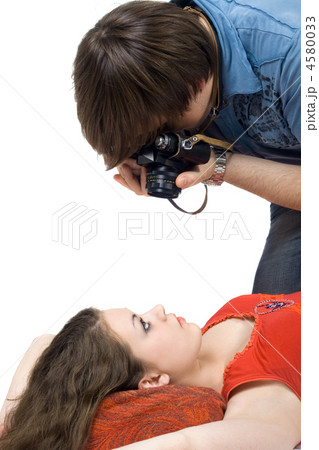 Photographer taking pictures of the young woman 4580033