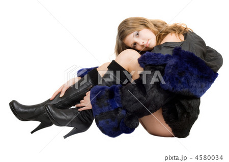 Beautiful girl in a fur coat and boots Beautiful girl in a fur coat and boots 4580034