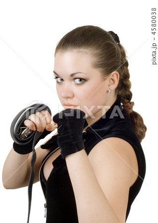 Pretty angry young woman throwing a punch. Isolated Pretty angry young woman throwing a punch. Isolated 4580038