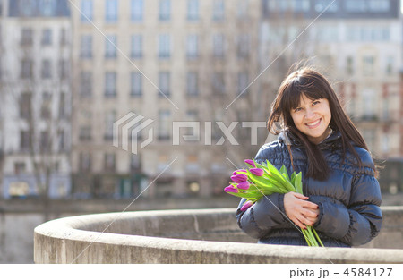Happy beautiful girl with tulips enjoying spring day in Paris 4584127