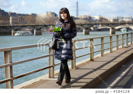 Happy beautiful girl with tulips enjoying spring day in Paris 4584128