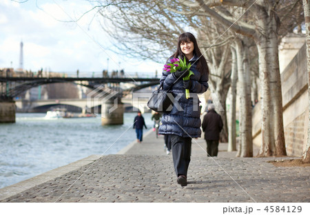 Happy beautiful girl with tulips enjoying spring day in Paris 4584129