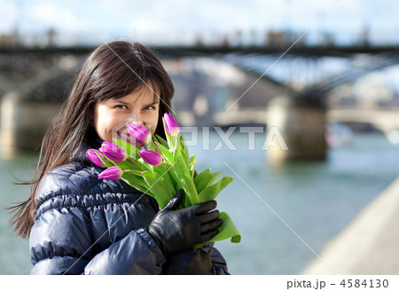 Happy beautiful girl with tulips enjoying spring day in Paris 4584130