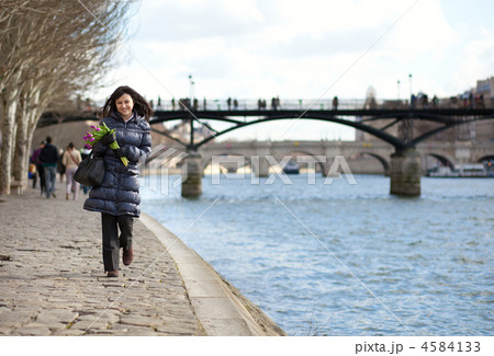 Happy beautiful girl with tulips enjoying spring day in Paris 4584133