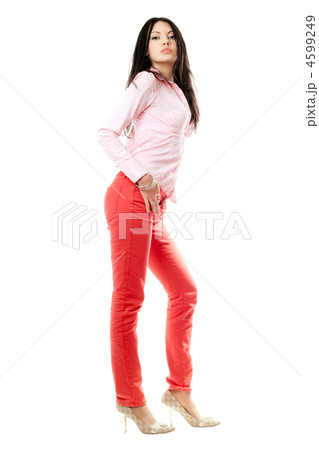 Beautiful young brunette in red jeans 4599249