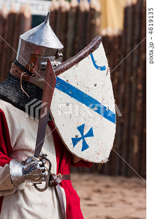 Knight in armour with shield and sword 4619135