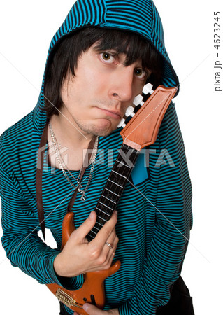 Bizarre young man with a little guitar. Isolated Bizarre young man with a little guitar. Isolated 4623245