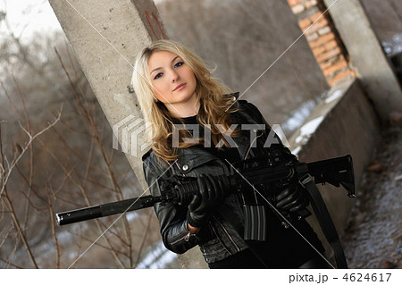 Beautiful young woman with a rifle 4624617