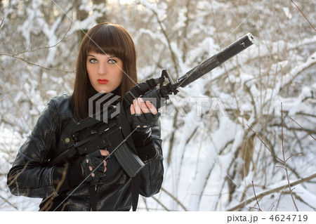Portrait of young lady with a rifle 4624719