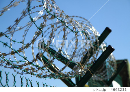 barbed wire against blue sky barbed wire against blue sky 4668231