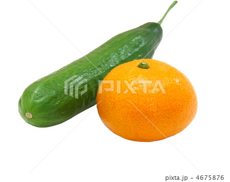 The fresh green cucumber with a tangerine 4675876