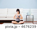 Asian woman practicing yoga at home. 4676239