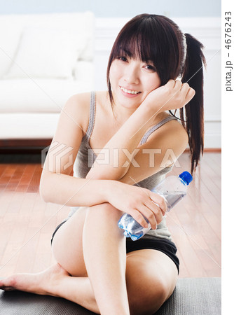 Asian woman with water bottle. Asian woman with water bottle. 4676243