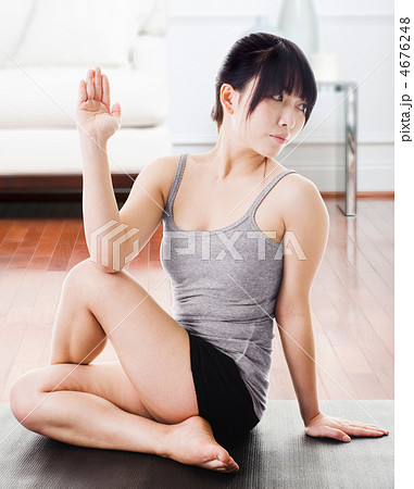 Asian woman practicing yoga at home. 4676248