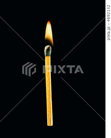 Burning match on a black background 4692132