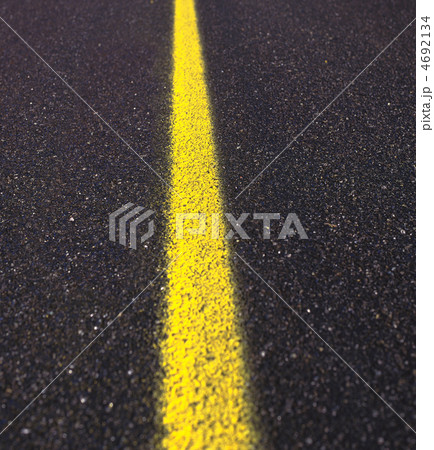 Asphalt road texture with yellow stripe Asphalt road texture with yellow stripe 4692134