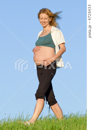 pregnant woman on meadow 4728433