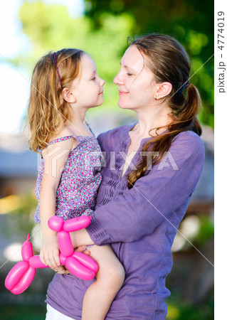 Mother and daughter outdoors 4774019