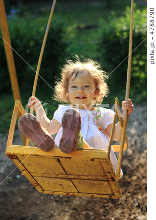 Playing on the swings Playing on the swings 4788790