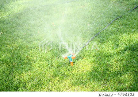 Sprinkler Spraying Water On Grass 4793302