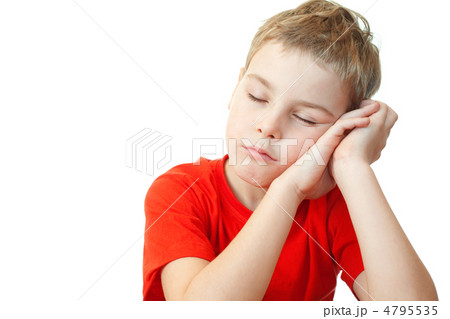 sweet little boy in red sports shirt sleep on his hands 4795535