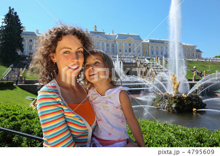 Mother with daughter  near fountains of Petergof, Saint Petersbu 4795609