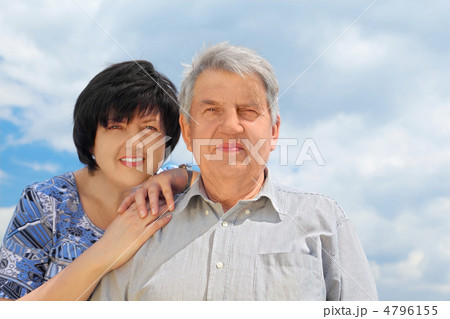 portrait of old senior, his adult daughter leaning to his should 4796155