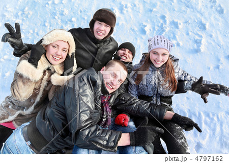 Students welter together in  heap on  snow 4797162